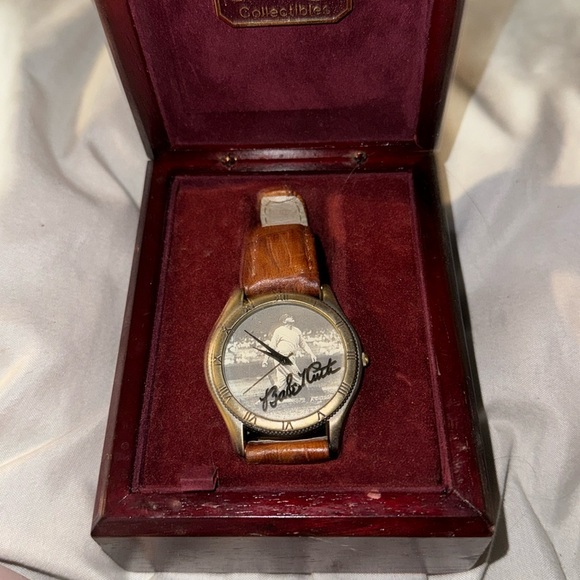 This is a collectible baseball watch the leather is brown with silver lining.